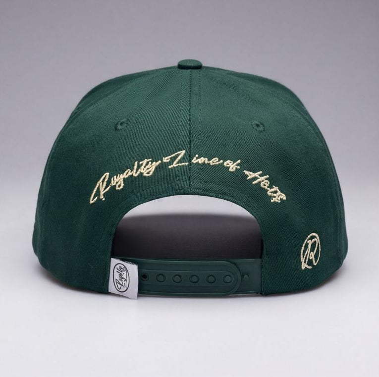 Green cap with detailed designs and text on a gray background