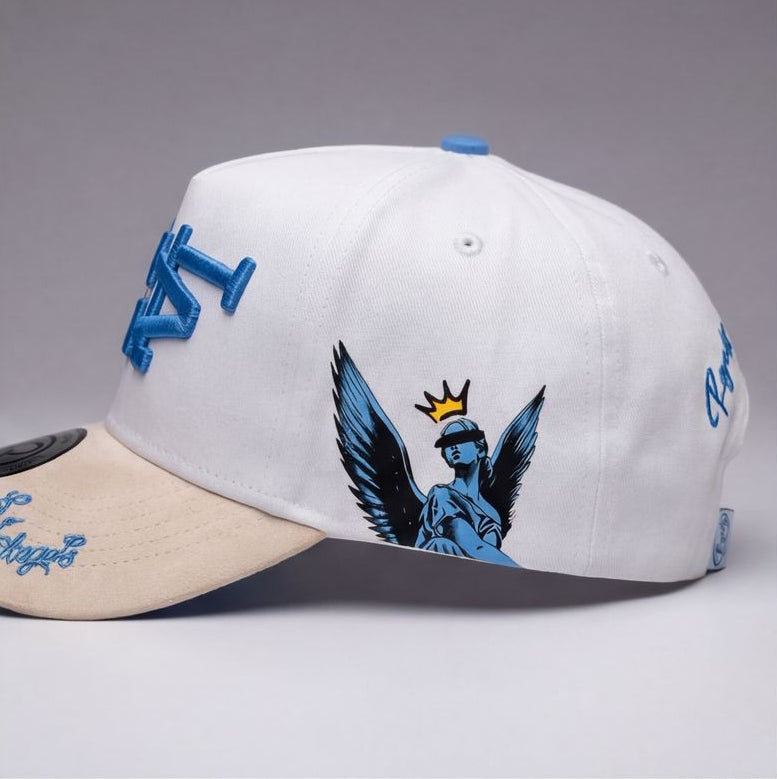 White and beige cap with blue and black designs on a gray background