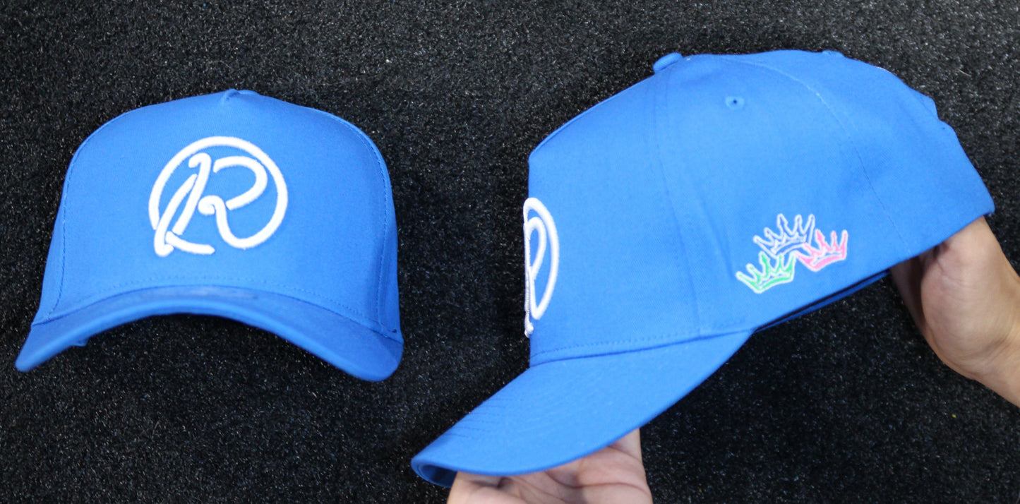 Two blue caps with logos on a black background