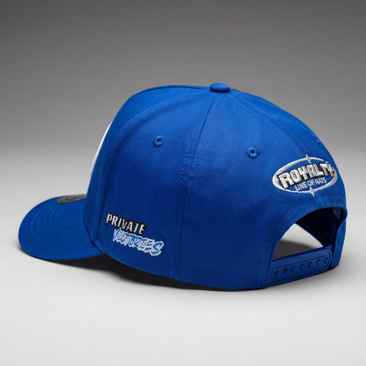 Blue cap with branding on a gray background