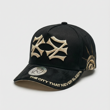 Black cap with gold emblem and text on a light gray background