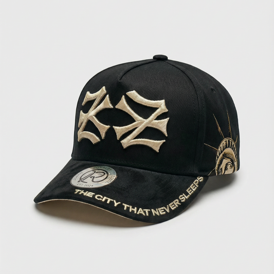 Black cap with gold emblem and text on a light gray background