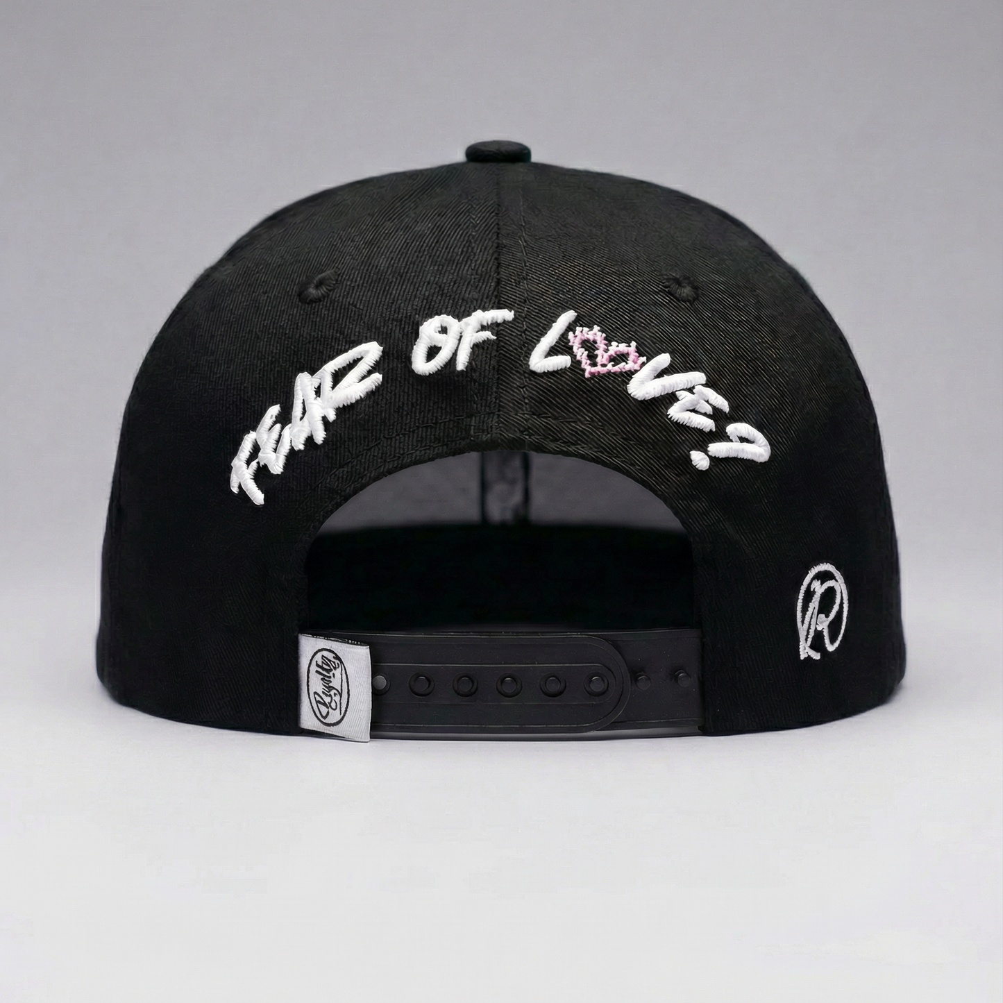 Black cap with white text on a gray background