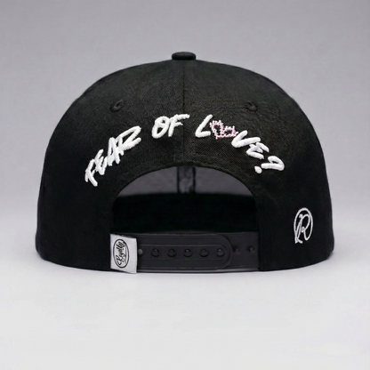 Black cap with white text on a gray background