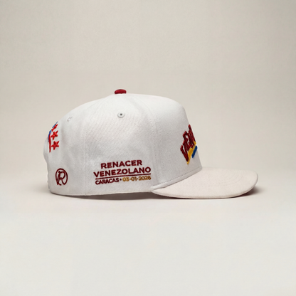 White cap with red and blue text and logos on a beige background