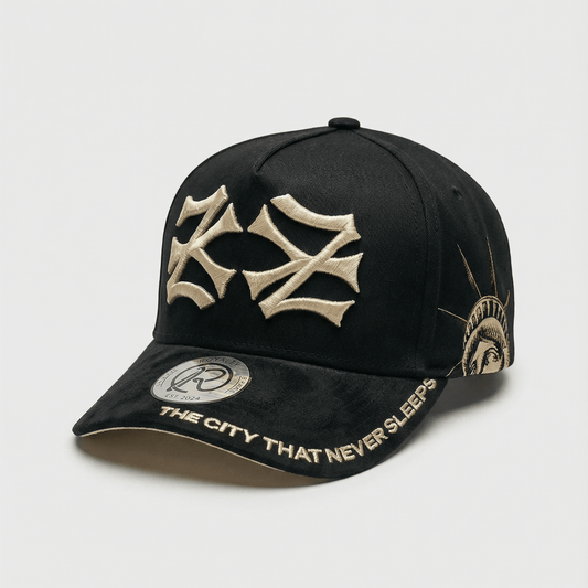 Midnight New York snapback, three-quarter front view: cream 3D-embroidered NY logo, Statue of Liberty side graphic and black suede brim